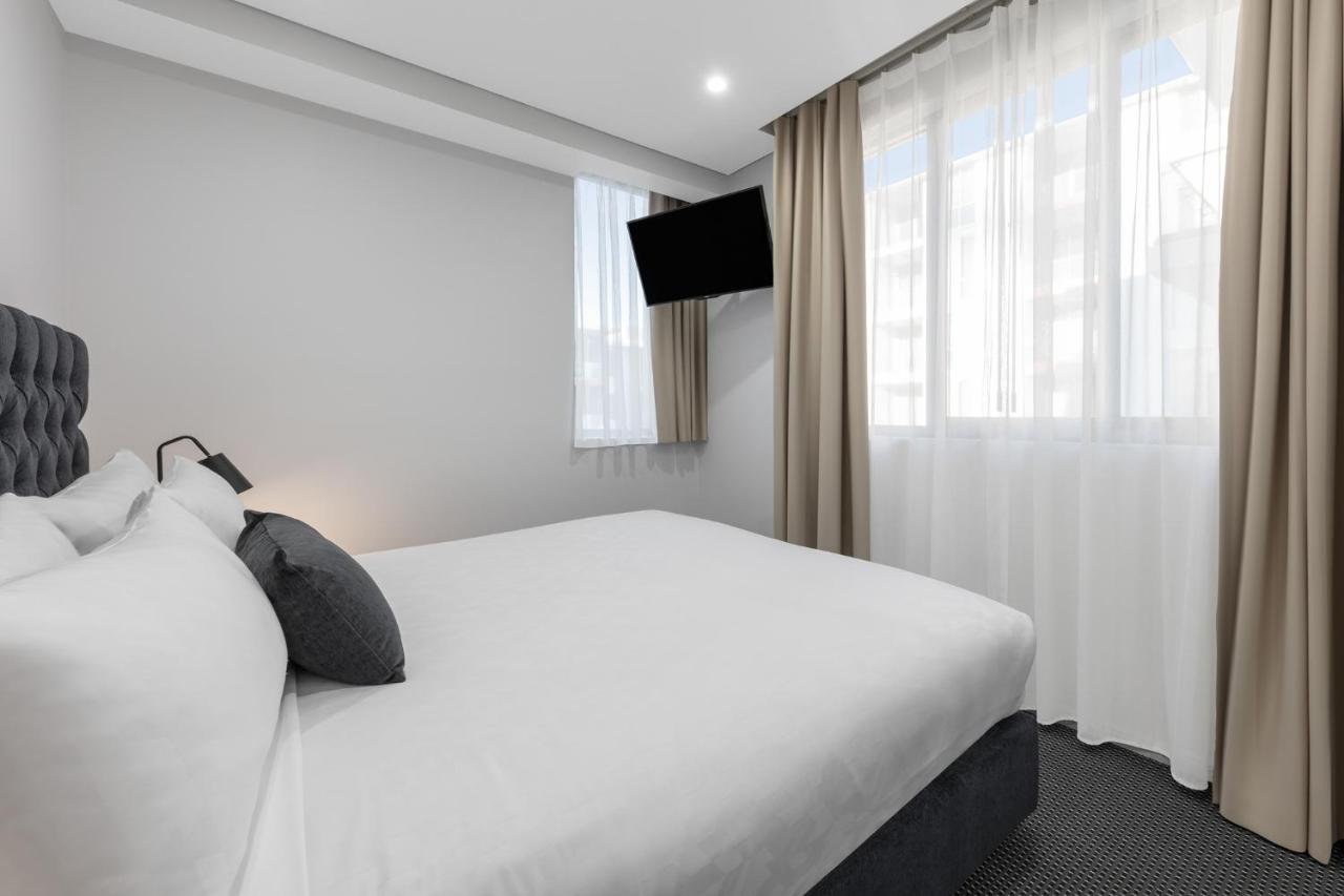فندق ميريتون سويتس نورث ريد سيدني المظهر الخارجي الصورة A bedroom at the hotel